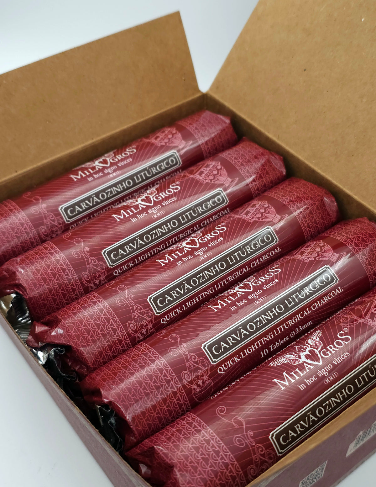 Open box of 100 quick-light charcoal tablets showing the rolls inside
