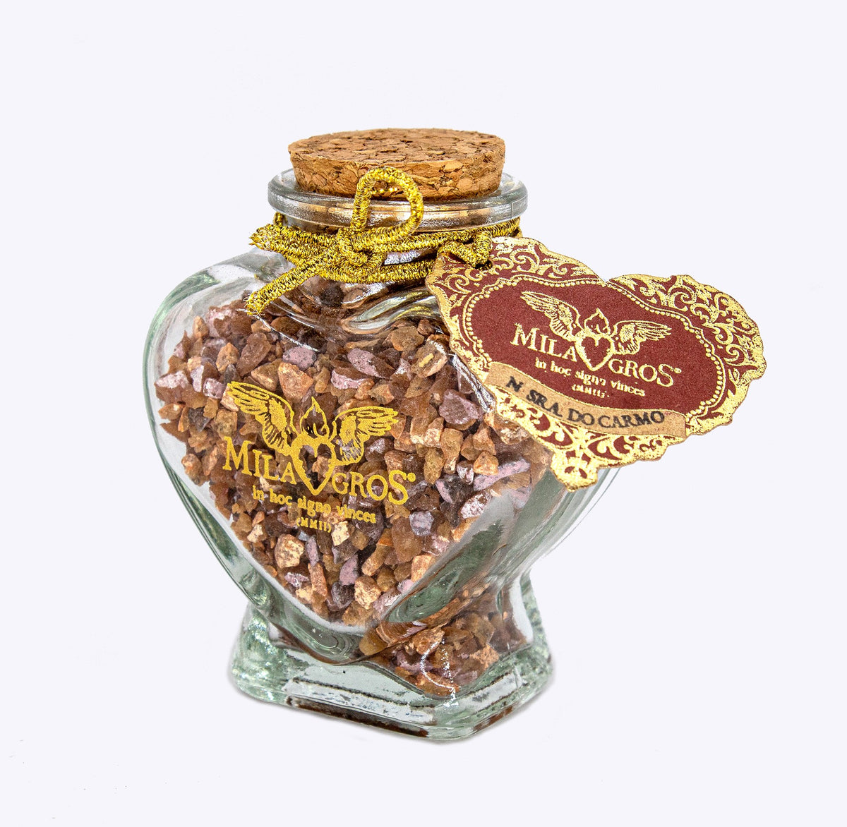 Close-up of the heart-shaped Cuore glass jar of Milagros Our Lady of Mount Carmel resin incense with cork stopper and heart hangtag.