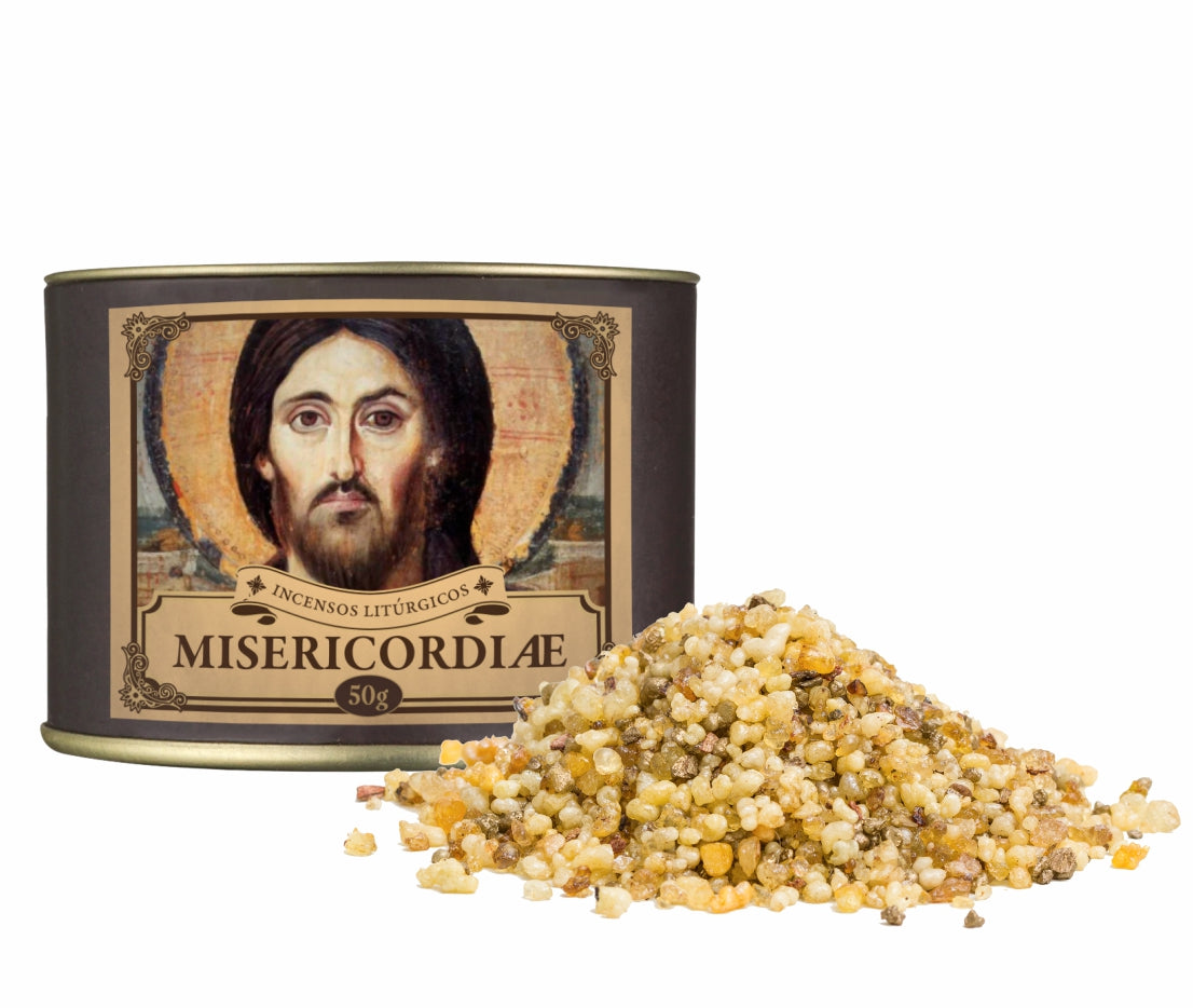 50g canister of Milagros Misericordiae resin incense beside a pile of resin grains.
