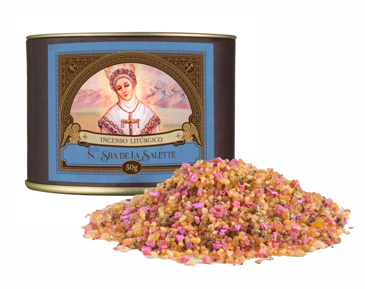 50g canister of Milagros Our Lady of La Salette resin incense beside a pile of resin grains.