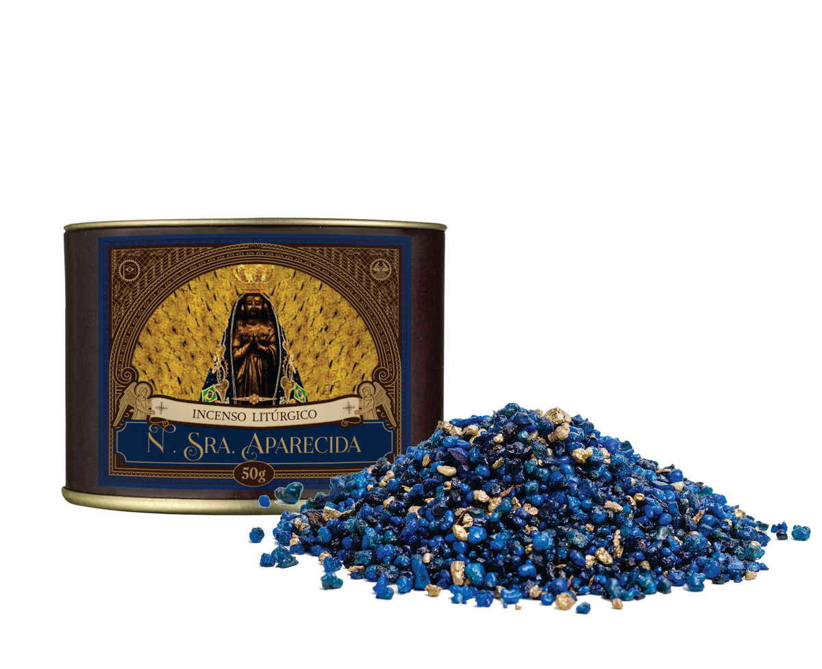 50g canister of Milagros Our Lady Aparecida resin incense beside a pile of resin grains.