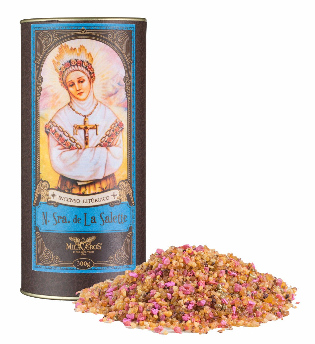 300g canister of Milagros Our Lady of La Salette resin incense beside a pile of resin grains.