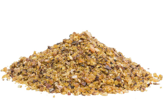 Loose resin grains of Milagros Casper incense, golden yellow drops.